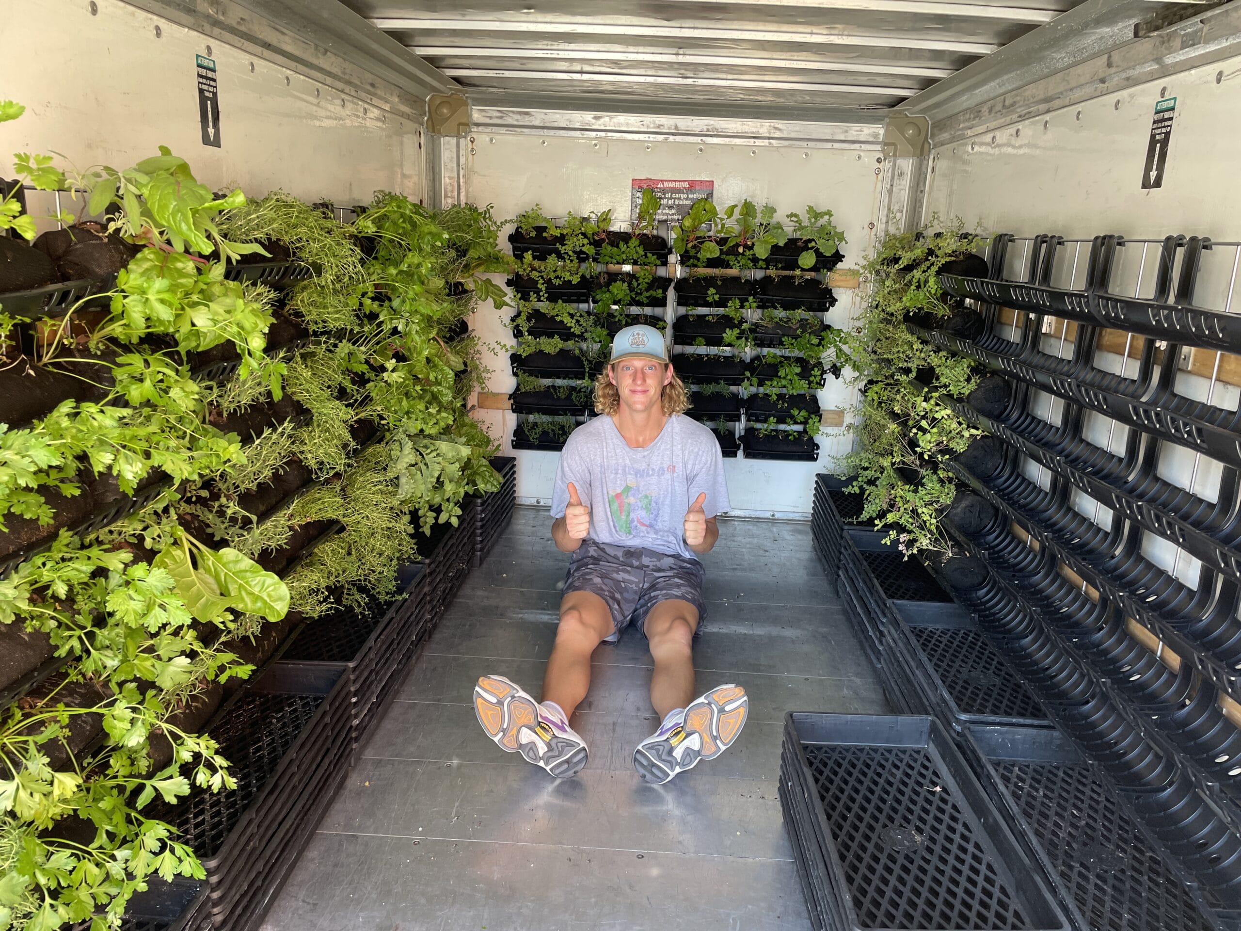 Matt in vertical garden transport trailer